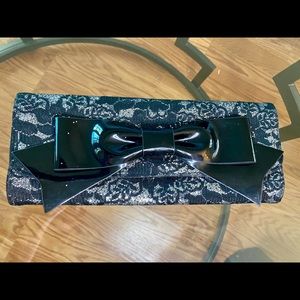 Black and silver lace clutch with Bow detail